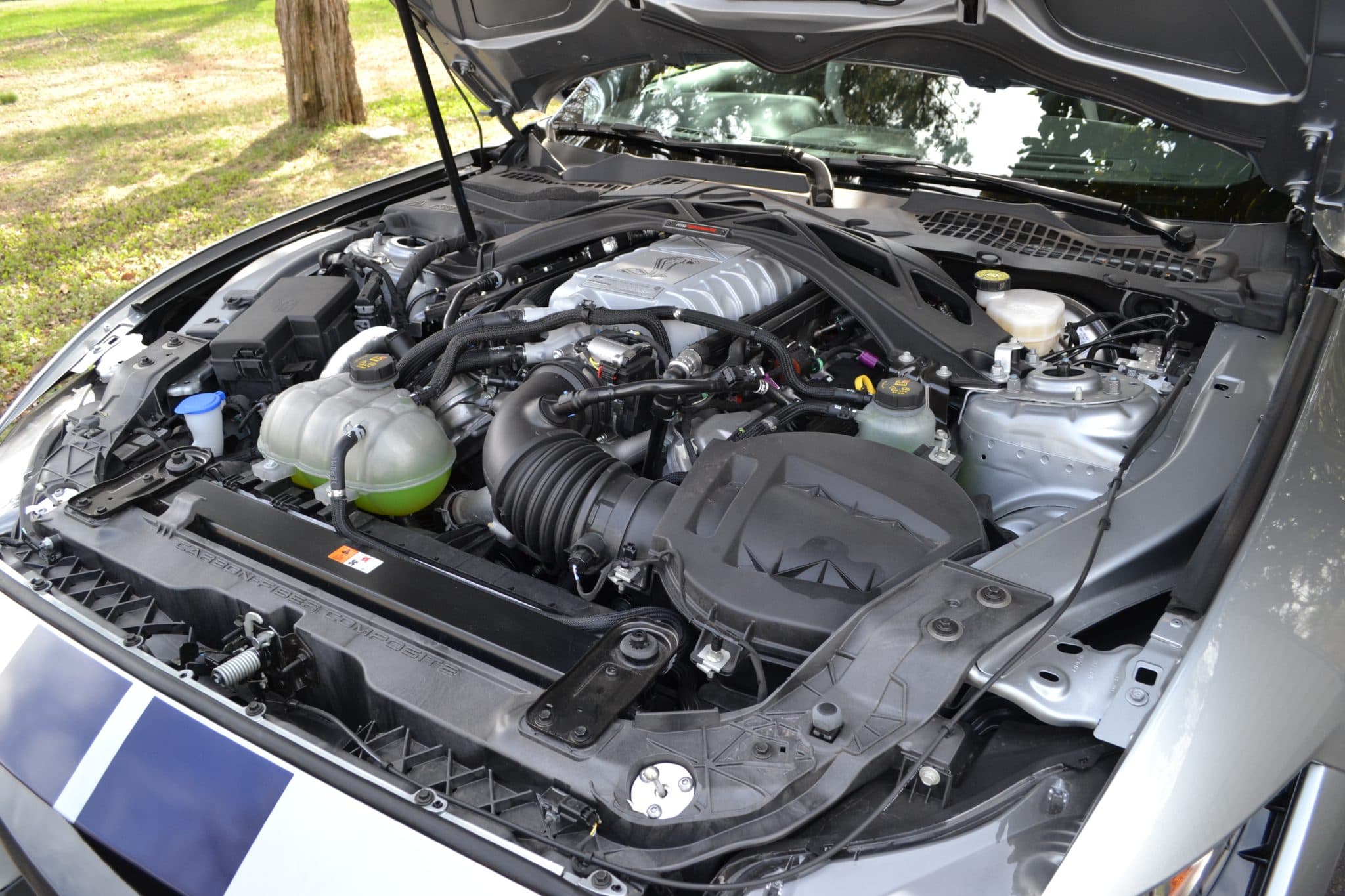 Supercharged V8 engine bay open for inspection