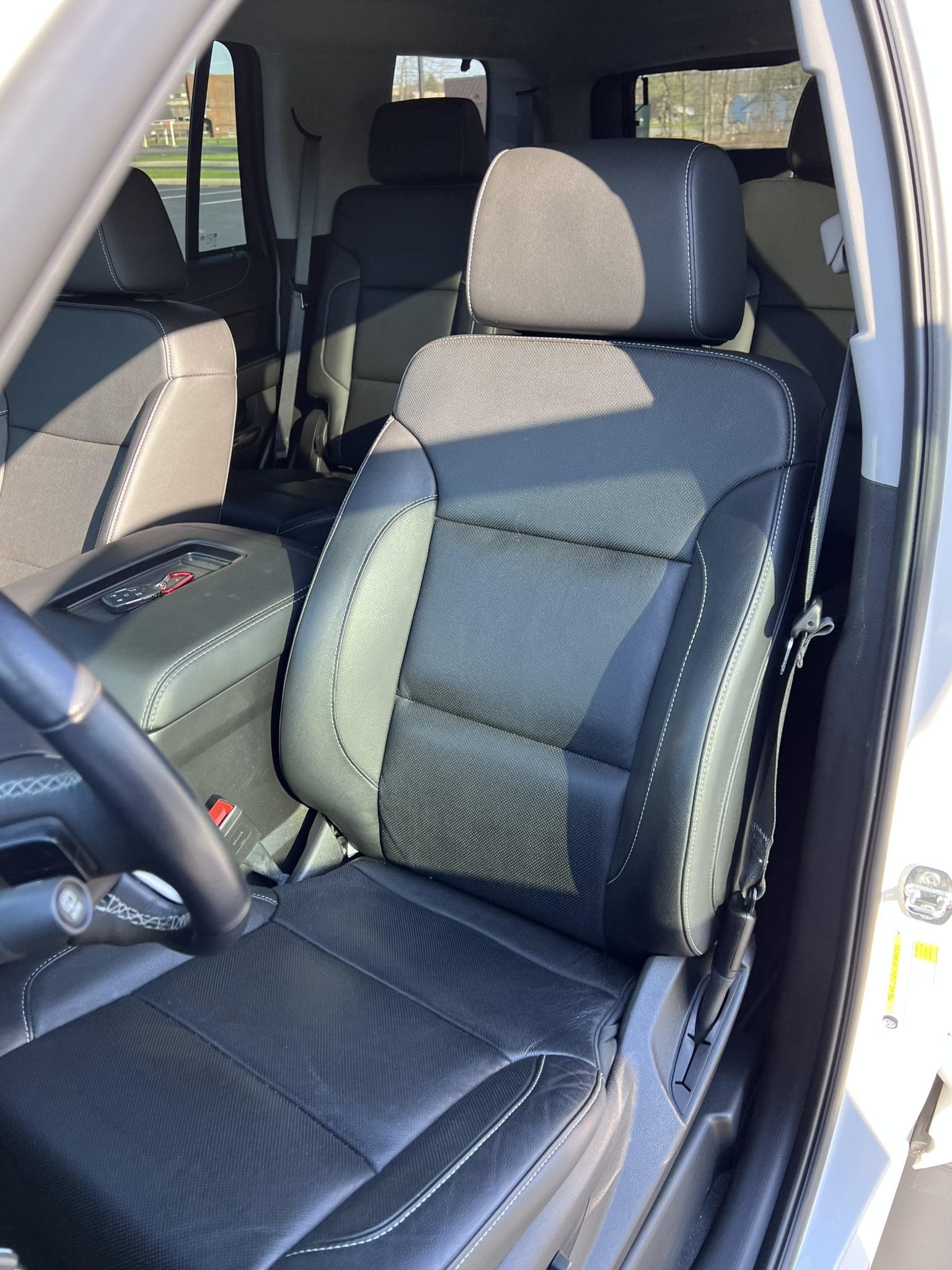 Front seats and cabin of a GMC Yukon premium SUV before hand-over
