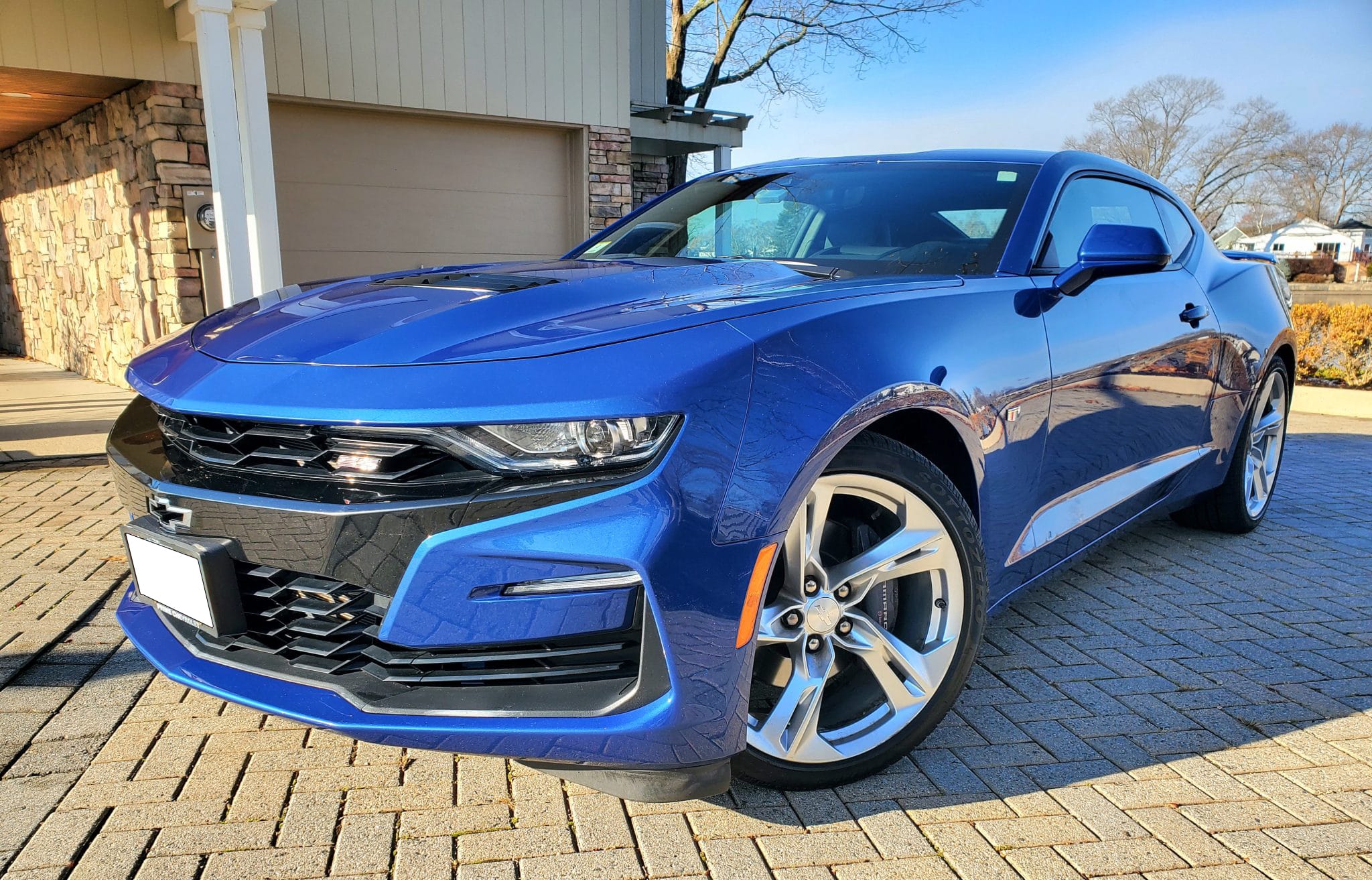 Blue Chevrolet Camaro SS on a private driveway